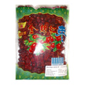 A clear plastic bag filled with dried red jasper dates, featuring a green decorative header with Chinese text and an illustration of red dates with green leaves. A white label with a barcode is visible near the bottom.