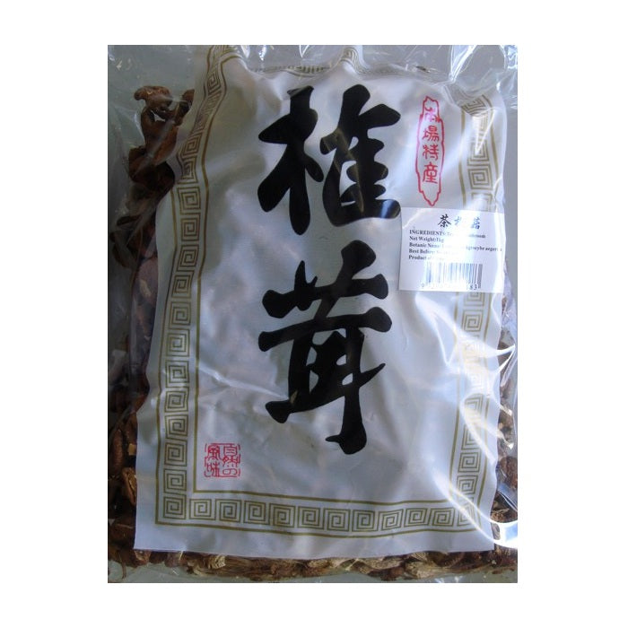 A clear plastic bag containing dried Chinese ginkgo biloba leaves, with a white paper label featuring large black Chinese characters and red seal stamps.
