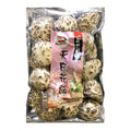 A clear plastic bag filled with dried mushroom slices, featuring a pink and white vertical label with Chinese text.
