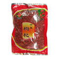 A bag of宁夏枸杞 (Ningxia goji berries) in a red plastic packaging with a clear window showing the dark red berries inside. The packaging features a yellow and orange central label with Chinese characters and a green and red goji berry illustration at the top.