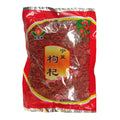 A bag of Chinese goji berries (Gou Qi) in a red and silver plastic packaging with a clear window showing the red berries inside. The package features Chinese characters and a logo.