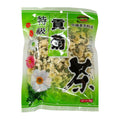 A 50g bag of Premium Chrysanthemum Tea in a bright green plastic packaging with white stripes, featuring illustrations of white and pink daisies and a large black calligraphic character for tea.