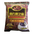A bag of Nanfang Black Sesame breakfast black sesame糊, featuring a brown and black label with yellow and red text, and a cup of black sesame coffee on the front.