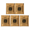 Five Astrapharm Peres Capsicum Plaster packet sleeves arranged on a white textured background, with four larger packets and one smaller packet.