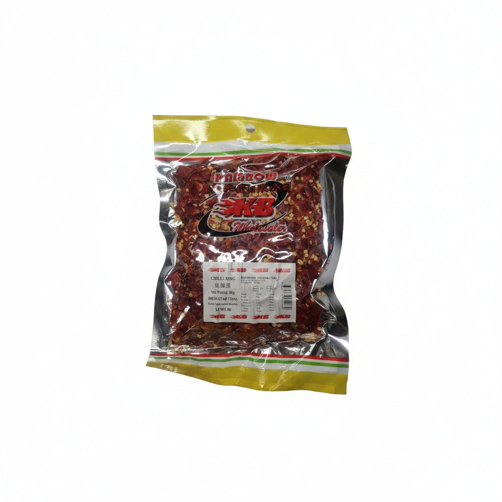 A clear plastic bag of Kam Bow KB Wholesaler Chili Rings, showing the red chili peppers and yellow seeds inside, with a white nutrition label on the front.