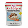 A 500g bag of mushroom seasoning seasoning mix. The packaging is white with red Chinese characters, black English text reading 'Mushroom Seasoning', a photo of mixed mushrooms and shiitake in a wooden bowl, and illustrations of carrots.