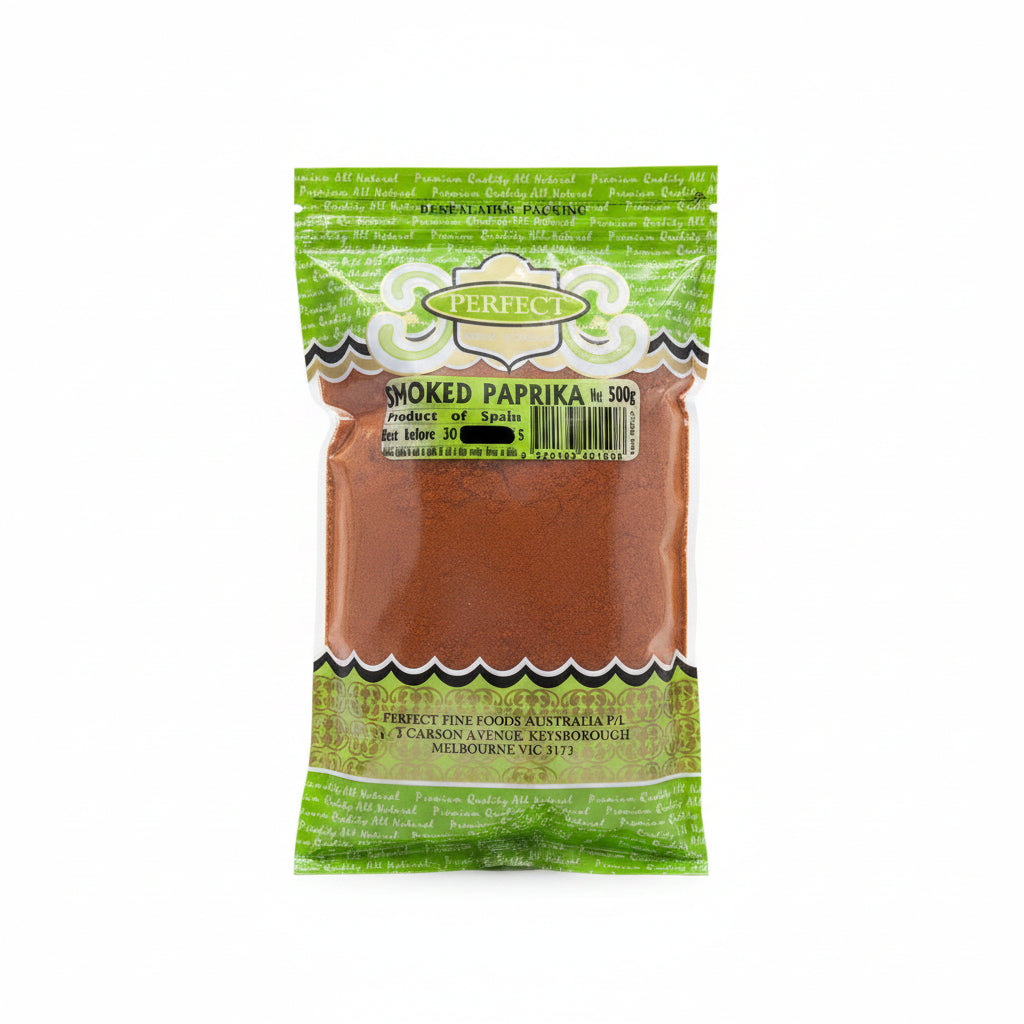 A 500g bag of Perfect brand smoked paprika, showing the brown spice powder inside through a clear window in the green packaging. A red text overlay at the top reads '2 packs'.