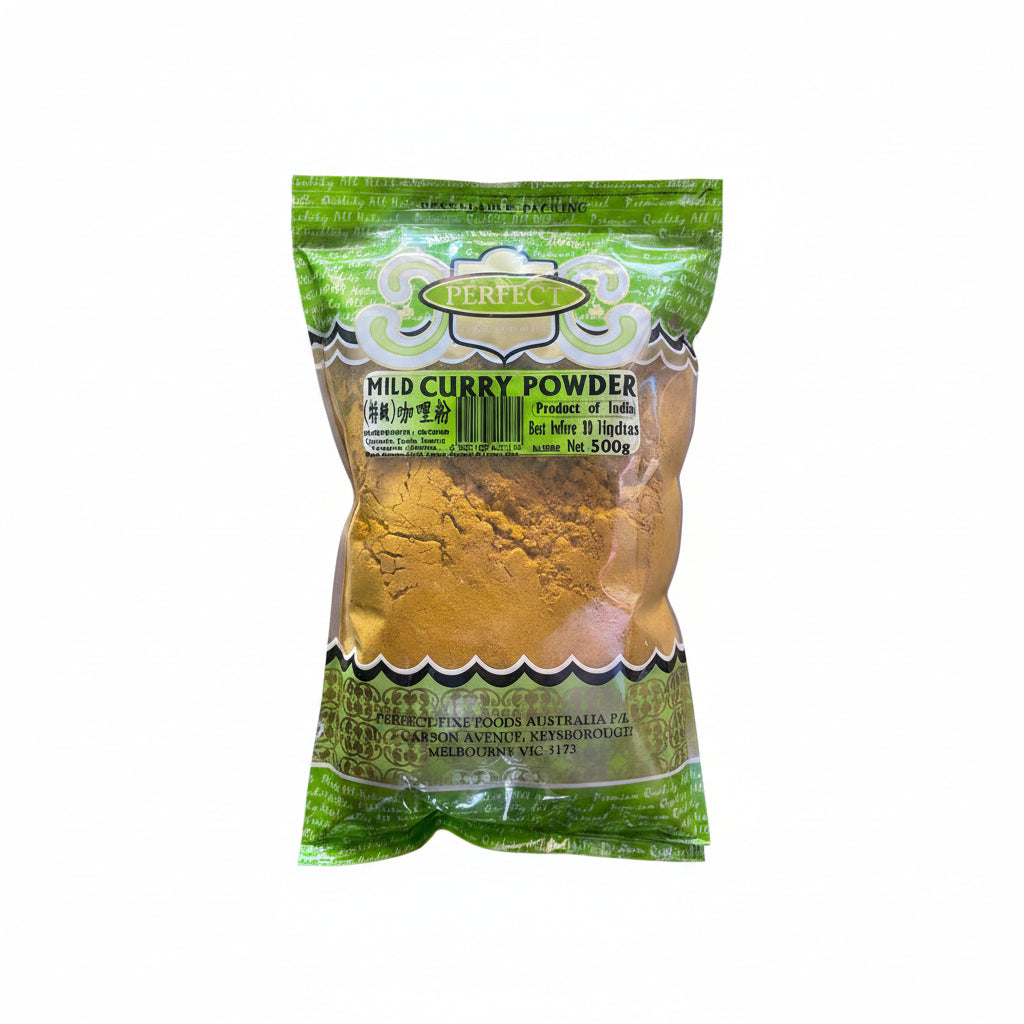 A 500g bag of Perfect Mild Curry Powder, showing the golden-yellow powder through a clear window in a green and white branded package.