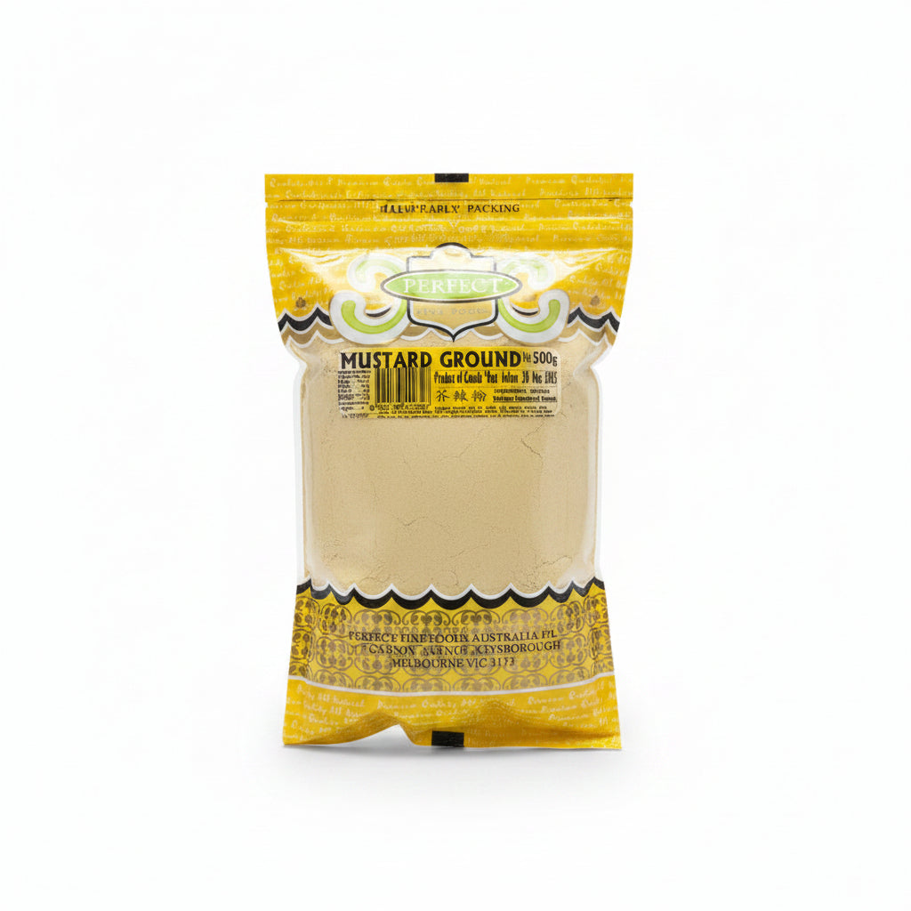 A 500g bag of Perfect Brand ground mustard powder, showing the light beige powder through a clear window in a yellow and green branded package.