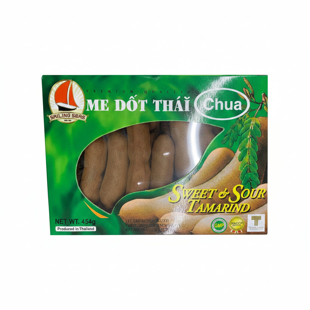 A package of Sailing Seas Sweet & Sour Tamarind, featuring a green box with a clear window showing several brown tamarind pods inside. The packaging includes English text 'ME DÙT THÁI Chua' and 'SWEET & SOUR TAMARIND' along with product certification logos.