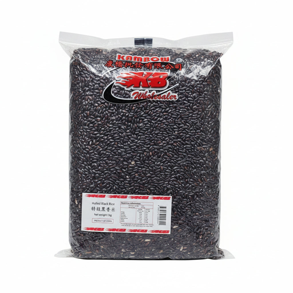 A large clear plastic bag filled with dark black rice, branded with 'Kam Bow' and 'BB Wholesale' logos, with a white nutrition label at the bottom left.