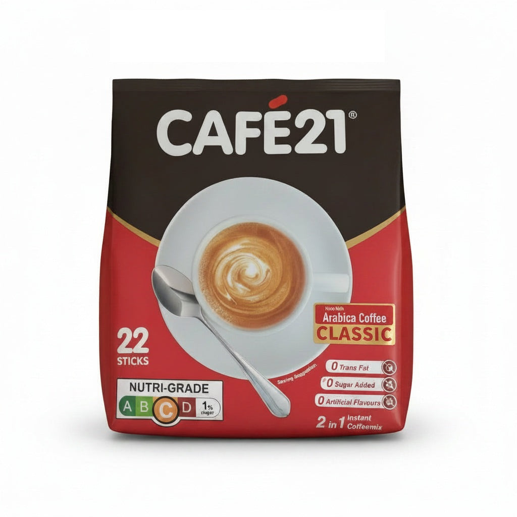 A package of CAFE21 Arabica Coffee Classic instant coffee sticks, 22 sticks total. The packaging is dark brown on top and red on the bottom, featuring a central image of a coffee cup with latte art and a spoon.