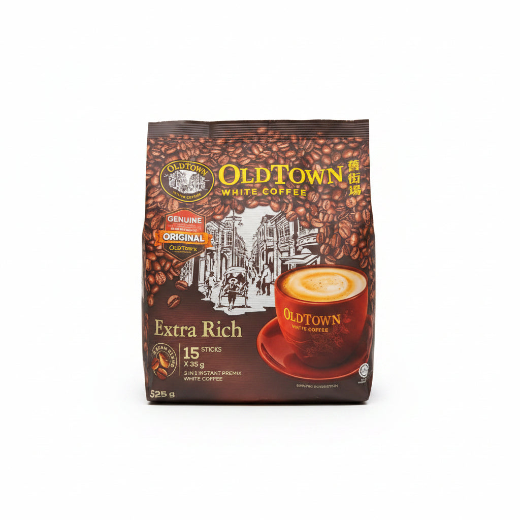 A package of OldTown White Coffee Extra Rich coffee sticks, featuring a dark brown bag with coffee bean graphics, a cup of coffee, and a white city illustration on the front, set against a plain white background.